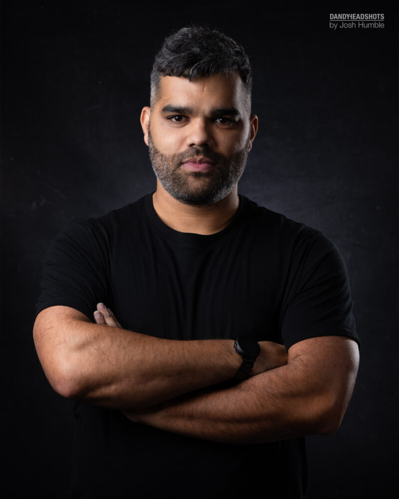 Low-key portrait of male actor.